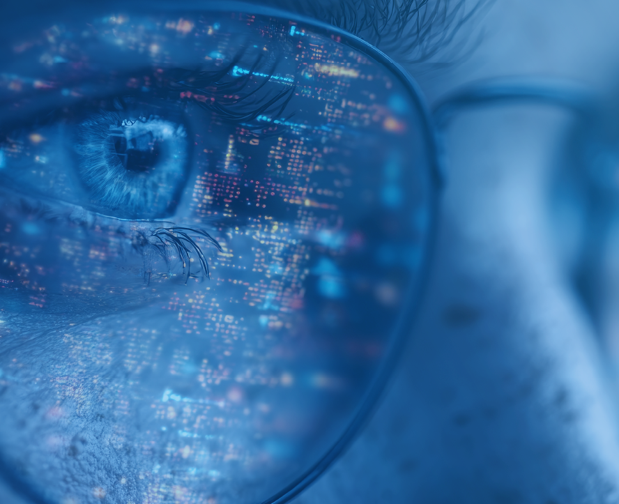 Close-up of a woman's eye and glasses reflecting digital data.